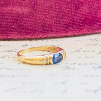 Timeless blue sapphire ring with tapered band and vintage gold setting
