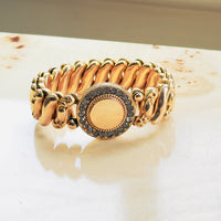 Unsigned mid-century American gold filled sweetheart bracelet with paste rhinestone halo face and oval link expansion band, curated by hipV