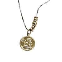Victorian 14k gold cherub pendant styled on a sterling silver slider chain with 14k gold accent beads.