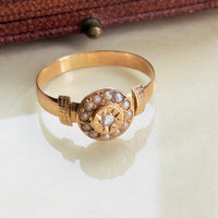 Victorian rose gold ring with rose-cut diamond and seed pearl halo circa 1890

