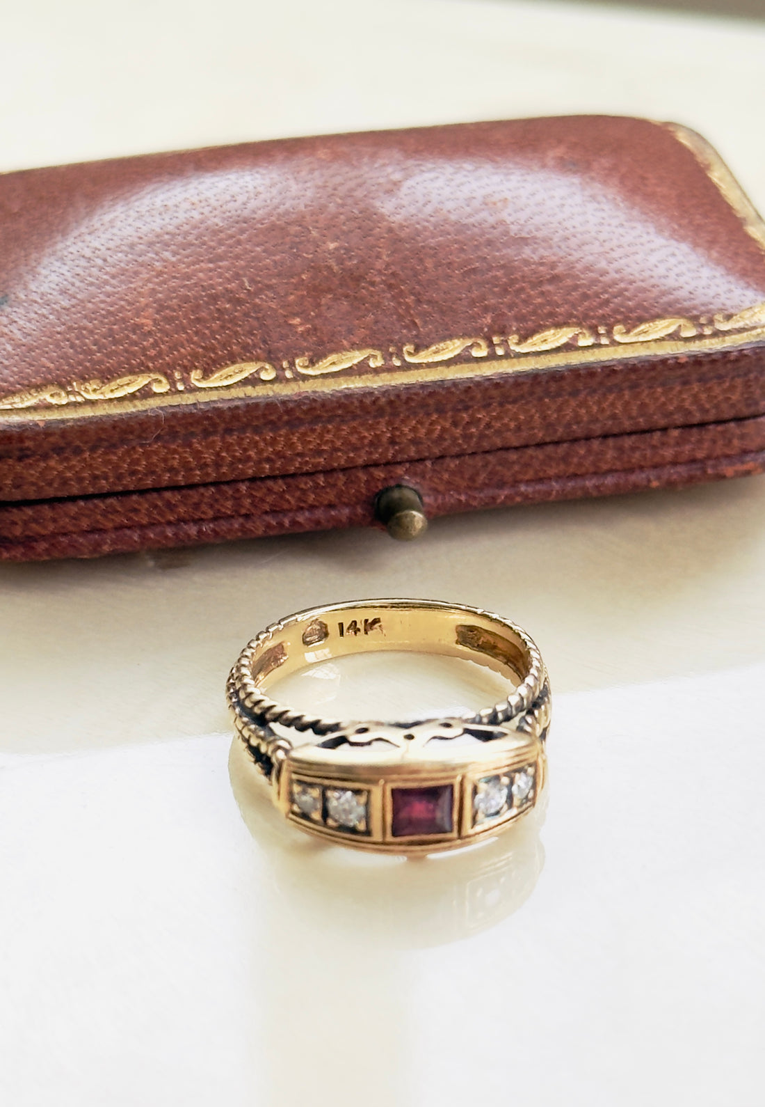 Vintage 14K gold ruby ring with diamond accents and sculptural setting