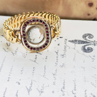 Vintage American Queen bracelet featuring cameo center with red stone accents
