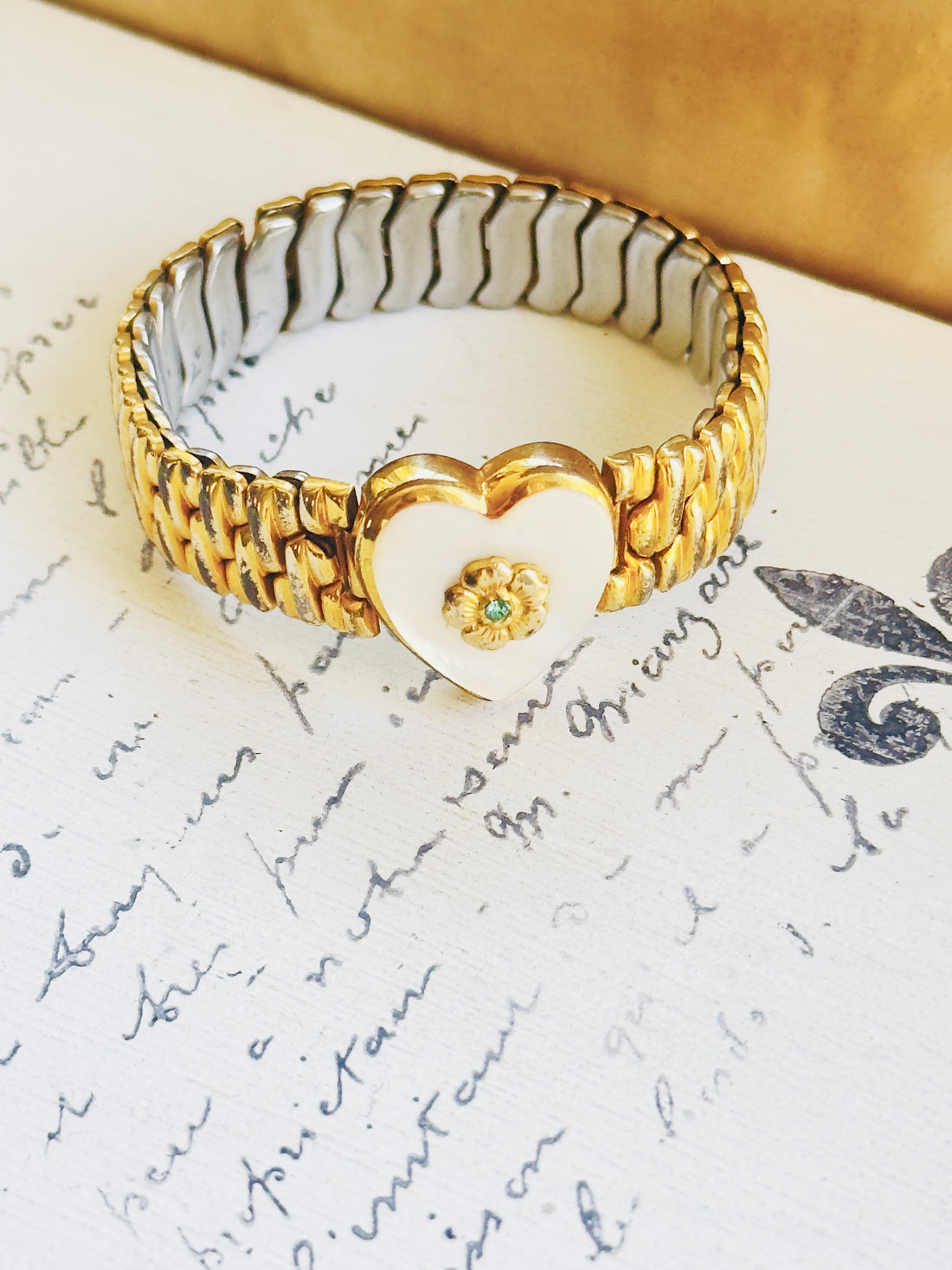 Vintage Co-Star sweetheart bracelet with mother-of-pearl heart and gold expansion band