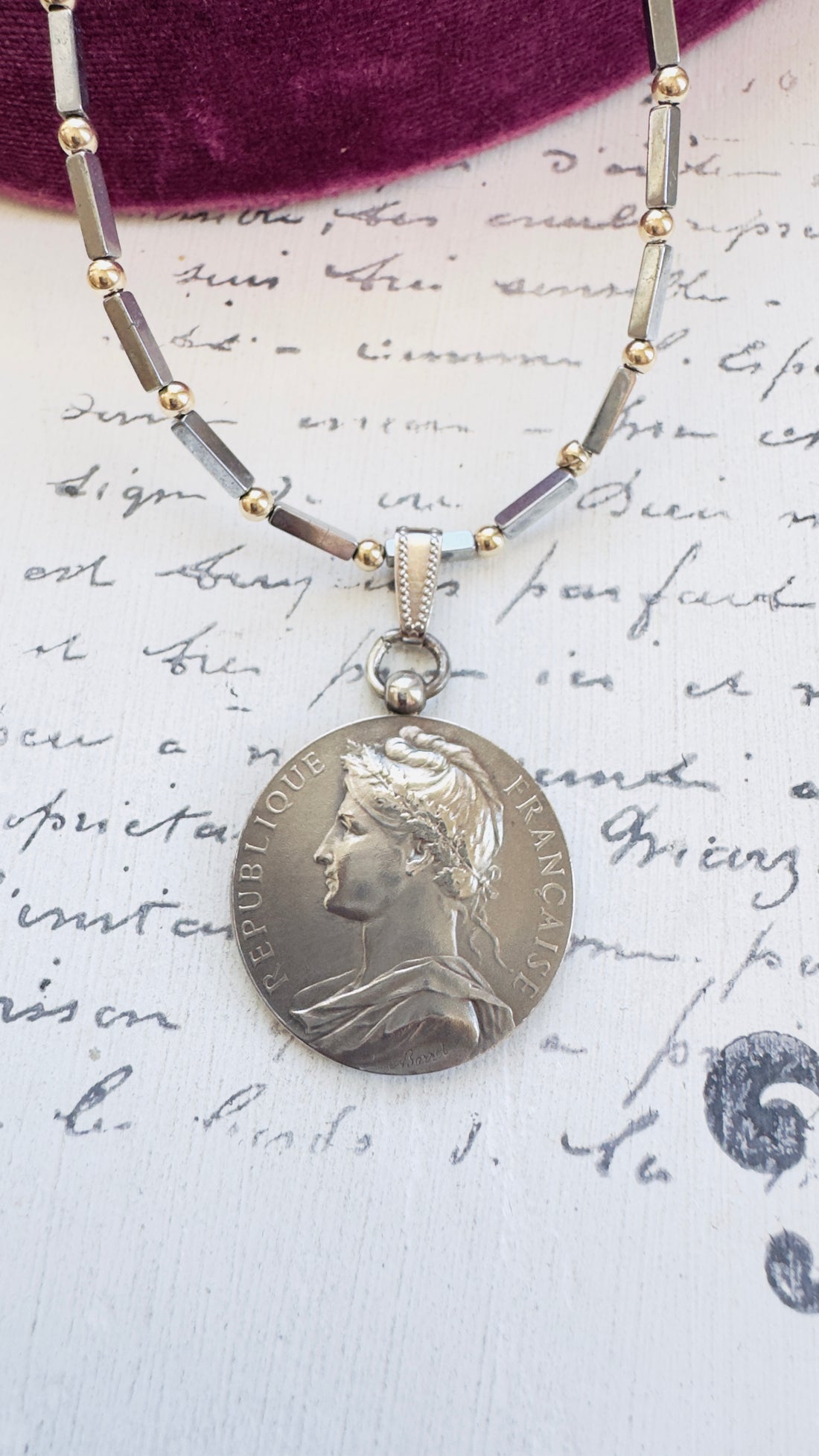 Vintage French coin pendant by A. Borrel on sterling and hematite chain