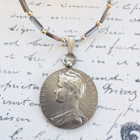 Vintage French coin pendant by A. Borrel on sterling and hematite chain