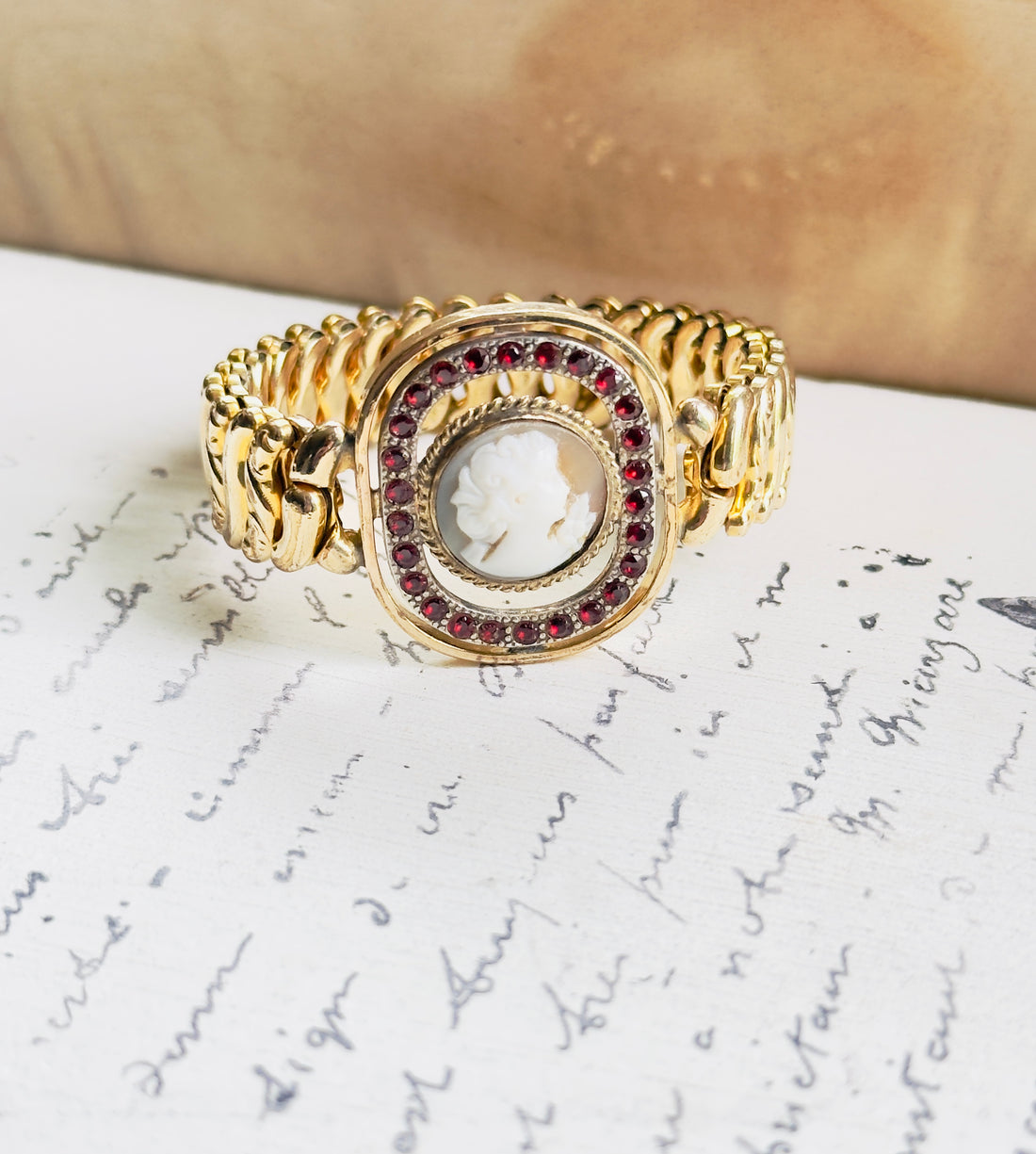 Vintage gold-filled cameo bracelet with red stone halo by American Queen