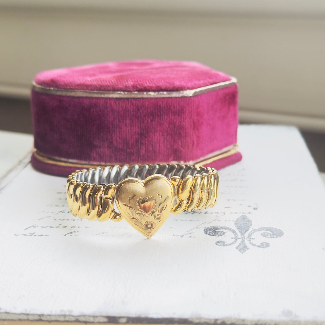 Vintage gold filled sweetheart bracelet by Bigney with Florentine finish and hand-engraved heart center with floral scrollwork