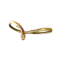 Vintage ruby snake bracelet in acid-tested gold featuring nine natural rubies and a flexible wrap design.