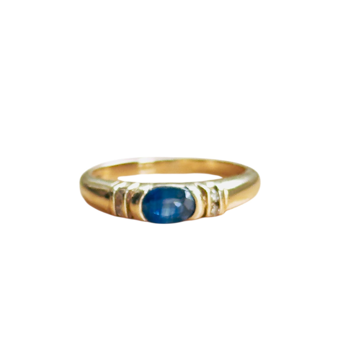 Vintage sapphire and diamond ring in 10K yellow gold with oval blue cabochon center