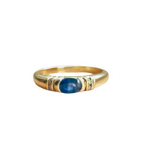 Vintage sapphire and diamond ring in 10K yellow gold with oval blue cabochon center