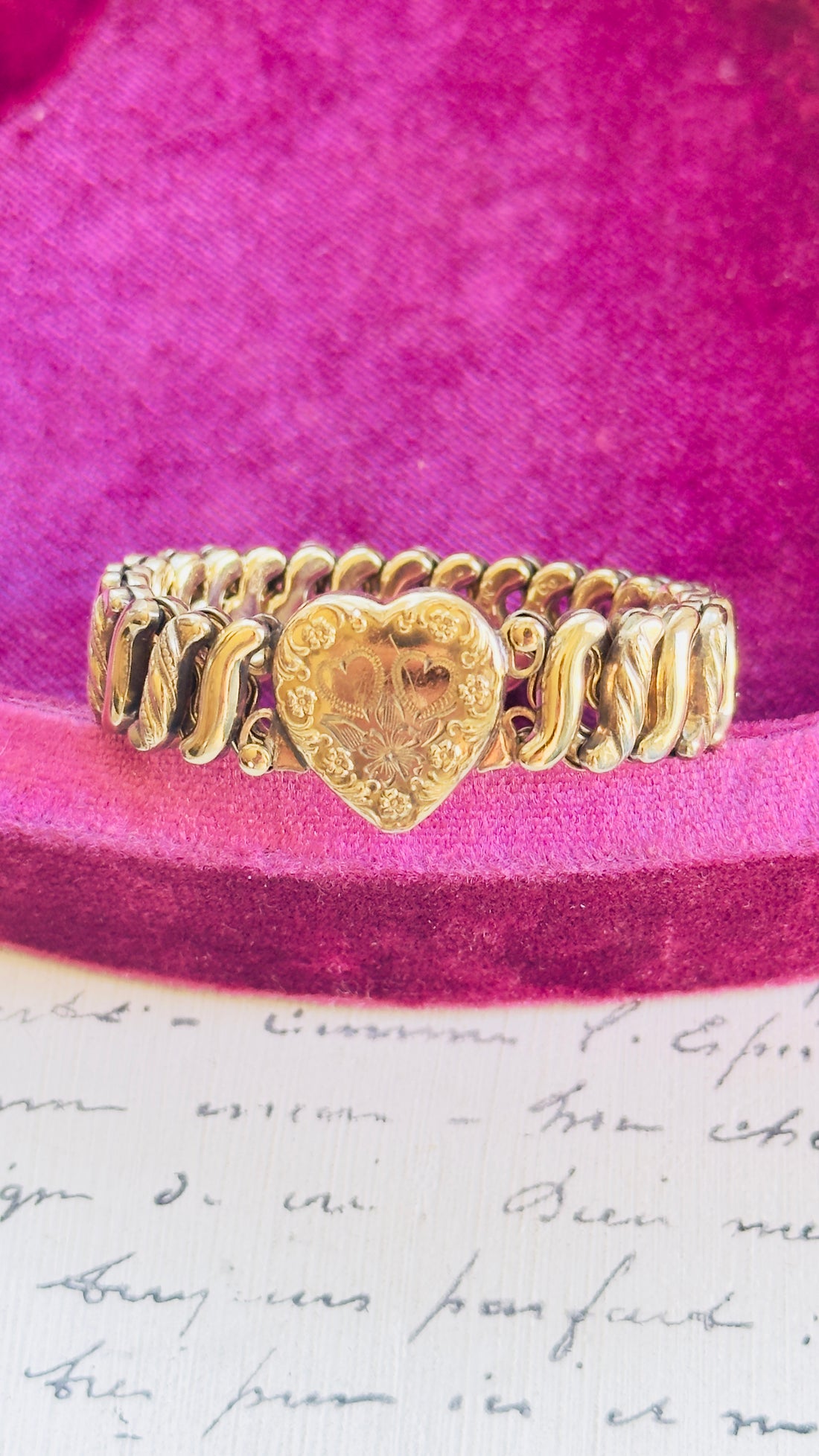 Vintage sweetheart bracelet by Bigney with engraved floral heart detail