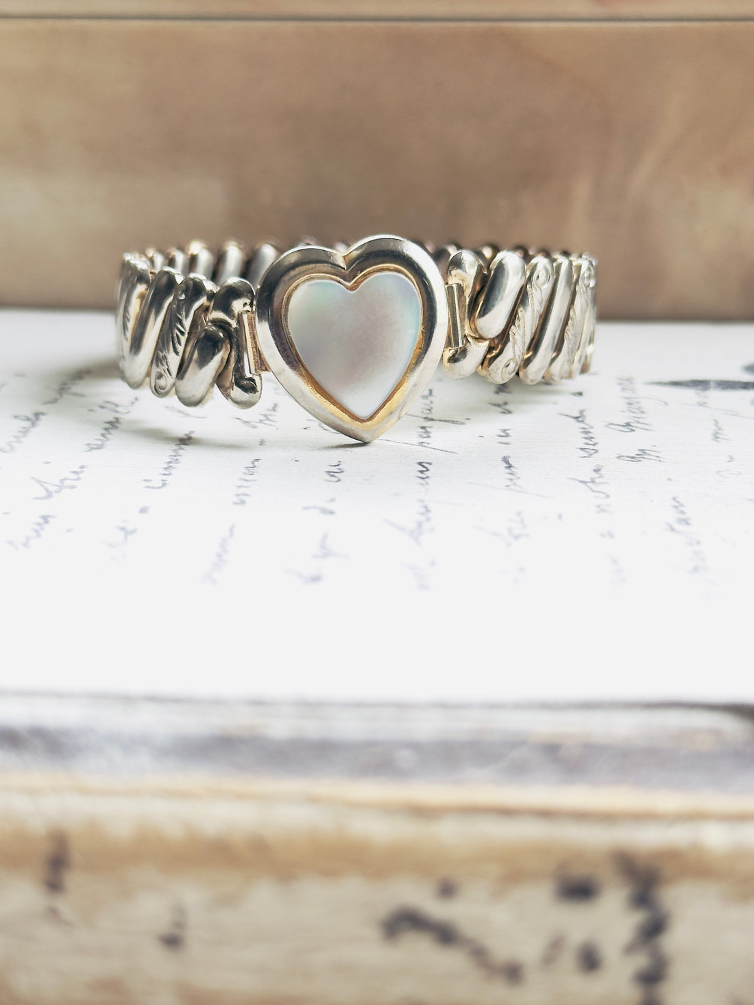 Vintage sweetheart bracelet with mother of pearl heart center and hand-engraved shoulder detail, no clasp expansion band, hipV Modern Vintage Jewelry