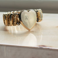 What is a locket sweetheart bracelet? Signed LACO vintage expansion bracelet with heart locket holding two photos, mid-century estate piece