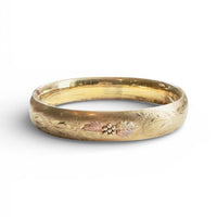 hipV gold floral bangle styled on neutral background