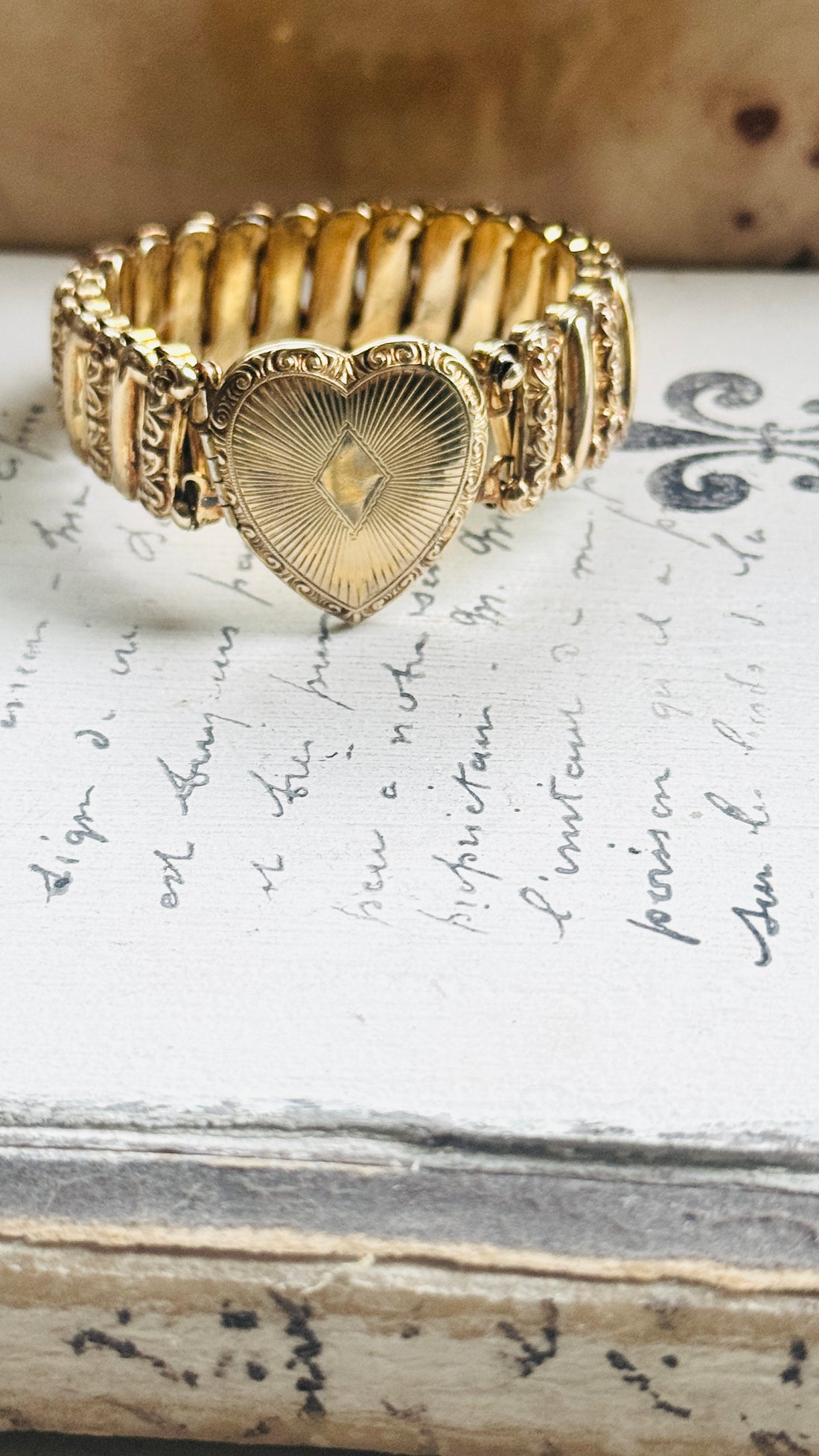 gold filled sweetheart bracelet with heart locket, shown with vintage jewelry box