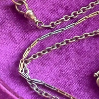 Detail of mixed 14k round links and 18k elongated links on chain.