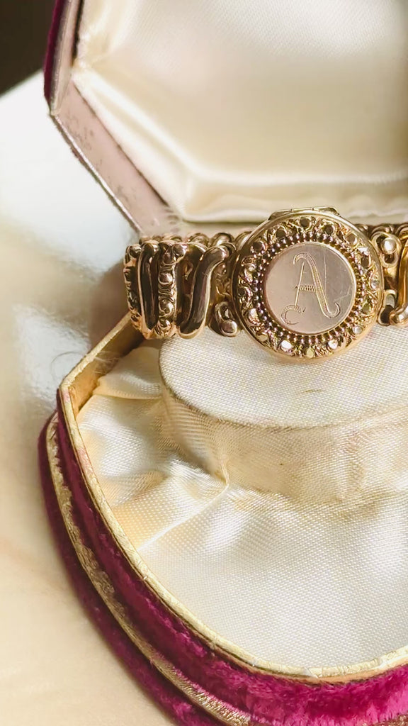 Video demonstrating an original Carmen gold-filled sweetheart expansion locket bracelet with engraved A monogram.