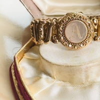 Video demonstrating an original Carmen gold-filled sweetheart expansion locket bracelet with engraved A monogram.