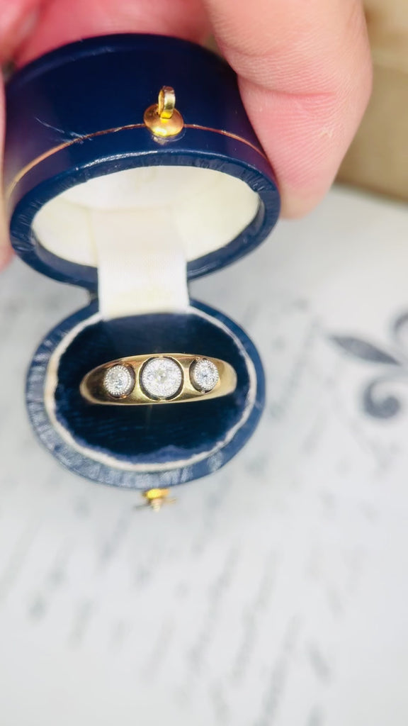 Video preview of a hand opening a box to reveal an antique diamond ring