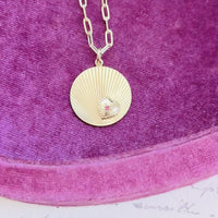 video of fluted disc neckace