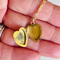 Gold Heart Locket that opens to hold 2 photos of your choosing