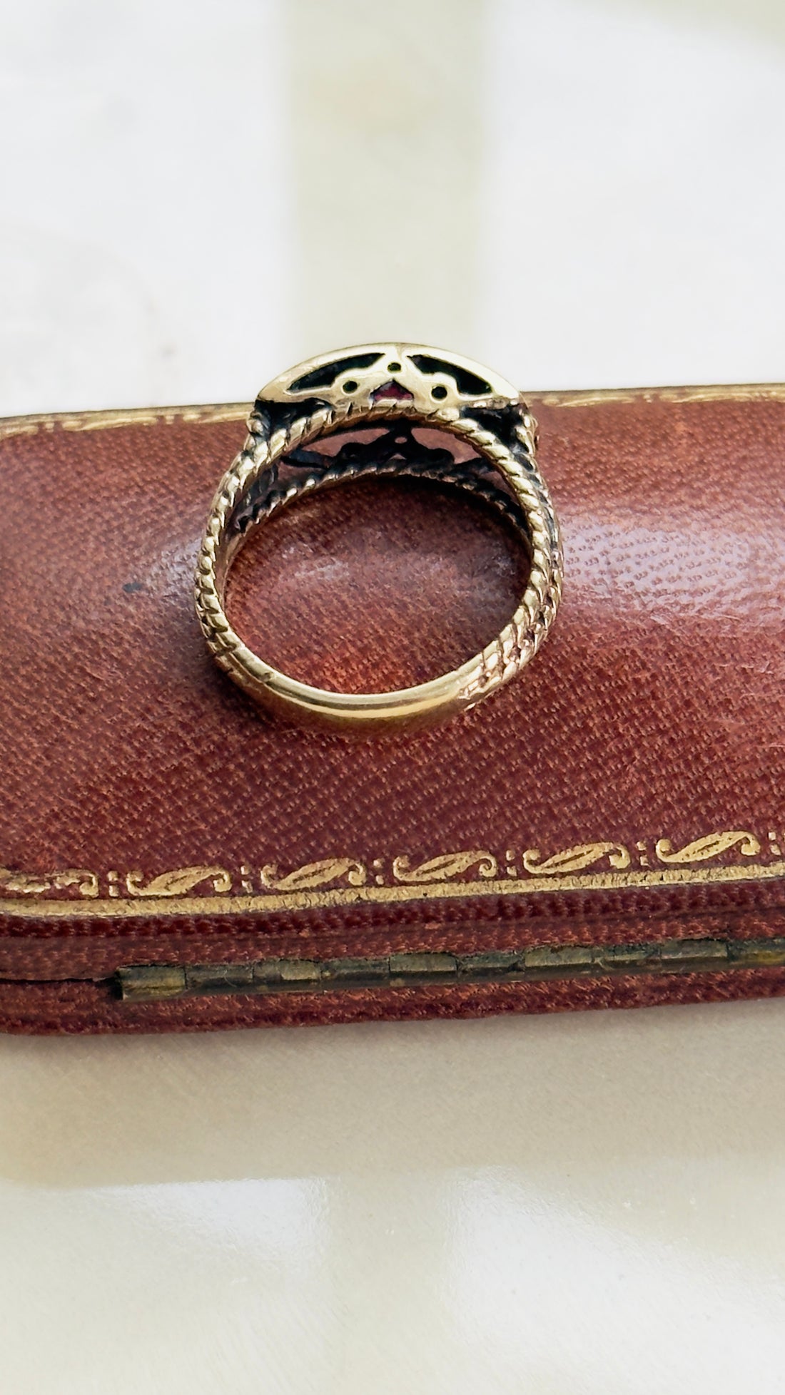 ruby and diamond ring in 14K yellow gold with rope twist band detail