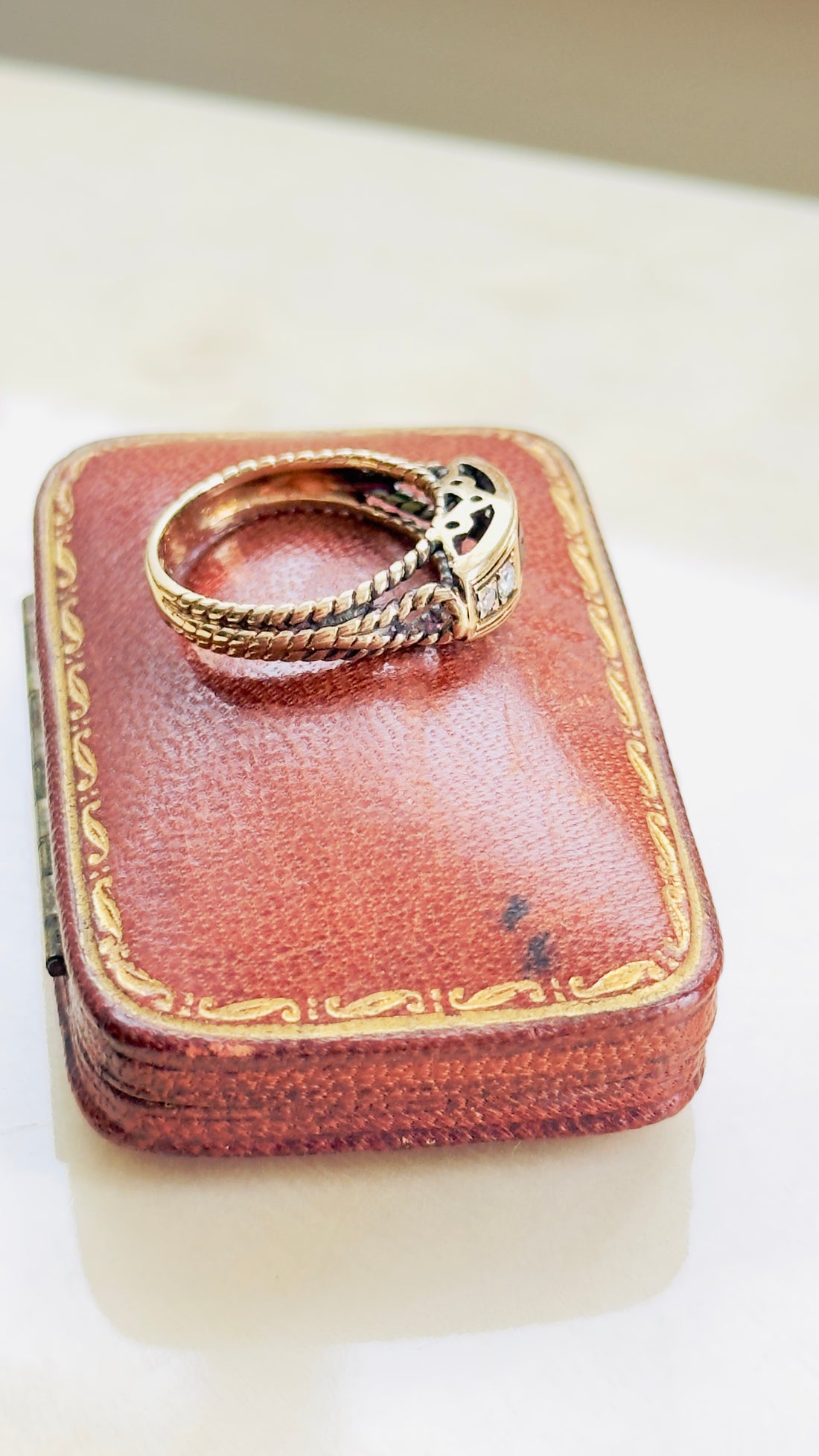ruby ring with rope twist detail and prong-set diamonds
