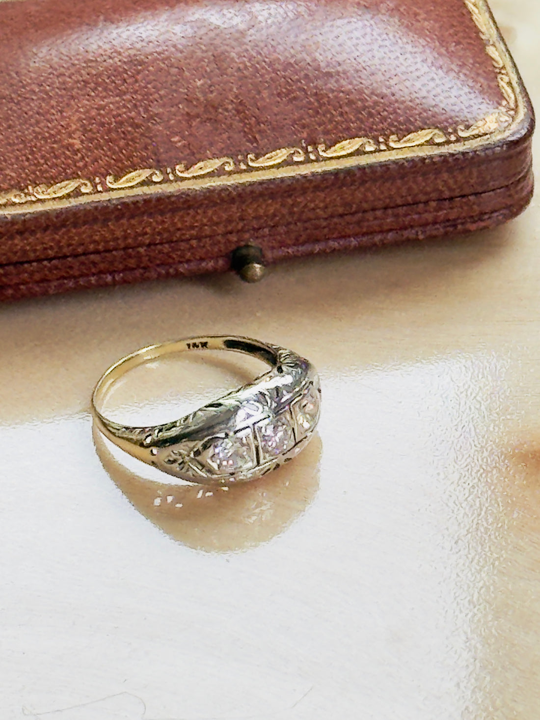 three-stone diamond band in 14K gold with H color VS2 clarity stones
