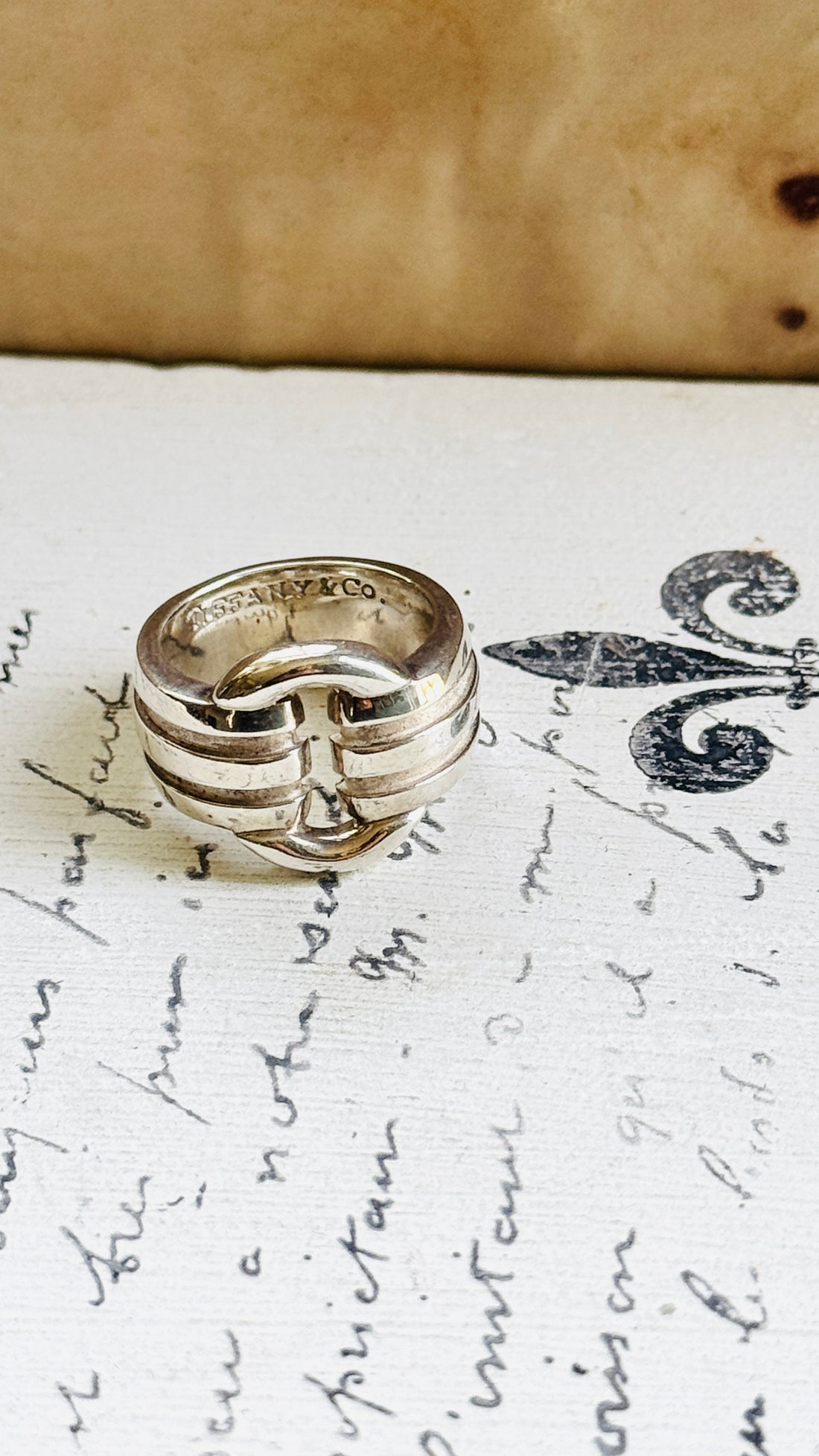 Tiffany Atlas ring angled to show the signed Tiffany & Co. 925 hallmark inside the band