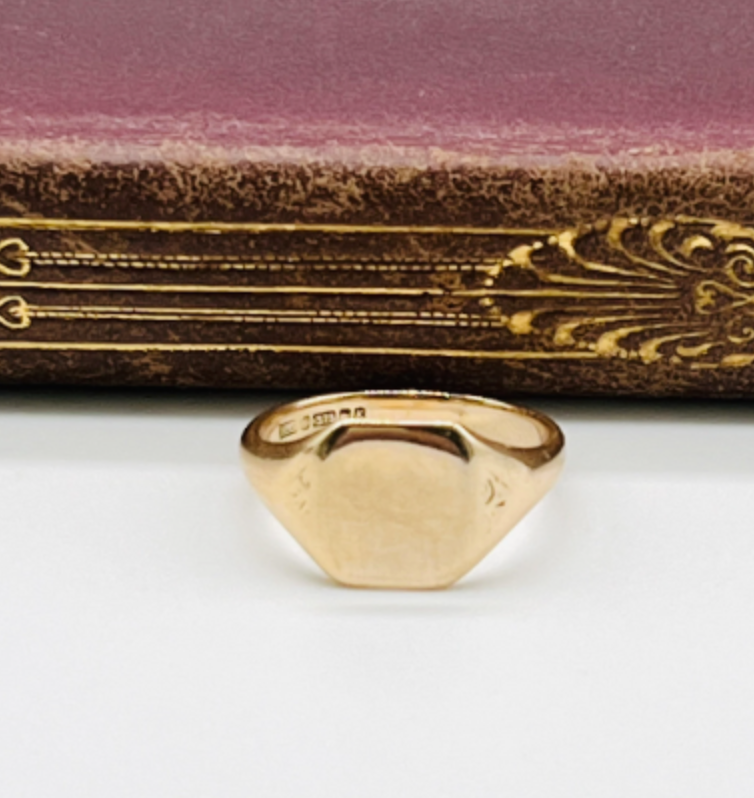 Vintage gold signet ring with oval flat top perfect for engraving monogram.