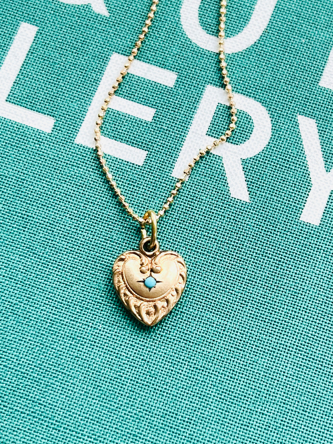 Vintage Repousse Heart Necklace with turquoise stone at the center by hipV Modern Vintage Jewelry.