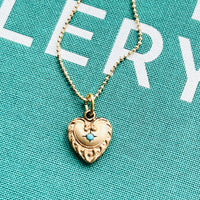 Vintage Repousse Heart Necklace with turquoise stone at the center by hipV Modern Vintage Jewelry.