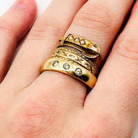 Stacking gold vintage rings with minimalist jewelry design.