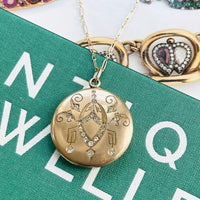 W&H Co. art deco necklace features a deco design on the front while the reverse side of the locket is blank allowing it to be personalized with your own inscription or monogram.