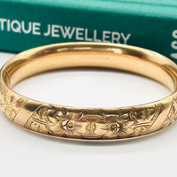 Vintage gold-filled antique bangle bracelet with floral design.