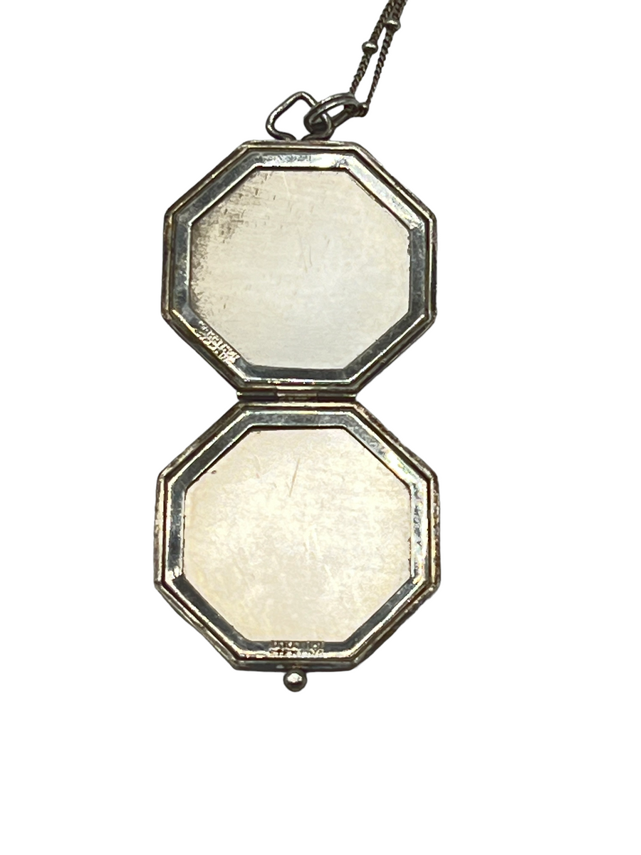 Sterling Silver Locket with Art Deco design is a timeless statement piece.