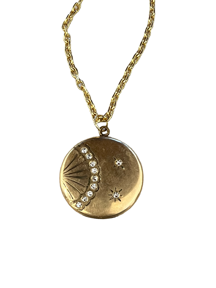 Bespoke vintage locket with gold design and 9 stones on the font. 