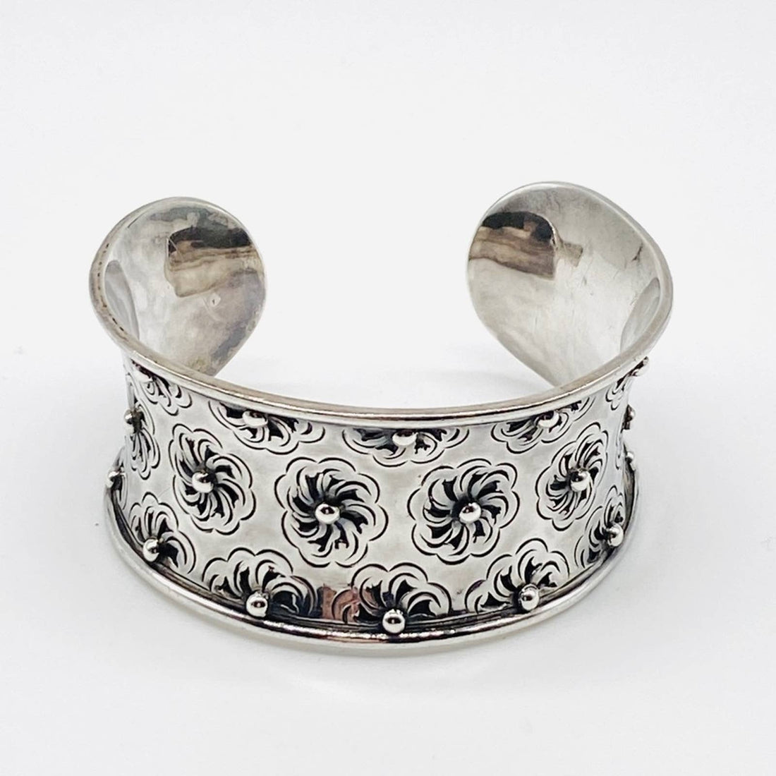 Wide sterling silver cuff bangle bracelet.